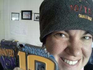 Medal and Hat from 10 miler and 10/Ten